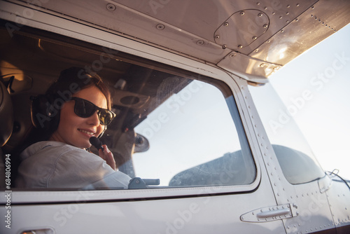 Woman-pilot in aircraft photo