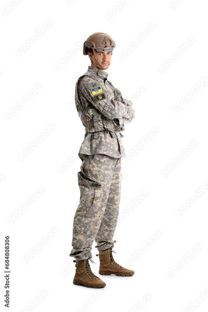 Young male soldier with Ukrainian chevrons isolated on white background Young male soldier with Ukrainian chevrons isolated on white background