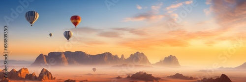 Mountains of Al Ula desert Saudi Arabia touristic destination, ballons at the golden sunset photo