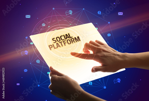 holding futuristic tablet, social media concept