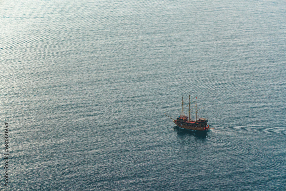 Fototapeta premium Lonely pirate old ship at sea