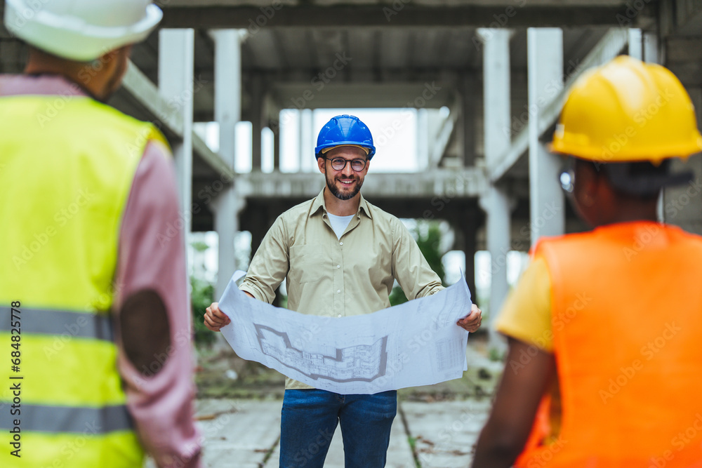 Diverse Team of Specialists Taking a Walk Through Construction Site. Real Estate Building Project with Senior Civil Engineer, Architect, General Worker Discussing Planning and Development Details. Diverse Team of Specialists Taking a Walk Through Construction Site. Real Estate Building Project with Senior Civil Engineer, Architect, General Worker Discussing Planning and Development Details.