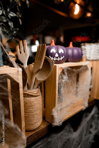 Fototapeta Naklejka Na Ścianę i Meble -  Wooden kitchen utensils decorated in Halloween style.