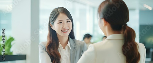 happy korean business woman manager handshaking at office meeting. smiling female hr hiring recruit at job interview. generative AI photo