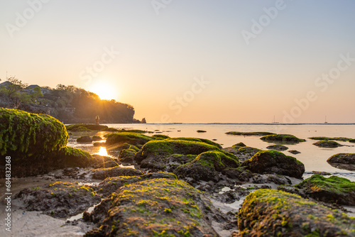BALI, INDONESIA - OCTOBER 29, 2023: Padang Padang Beach Bali. Sunset at the famous beach in Bali. Indonesia photo