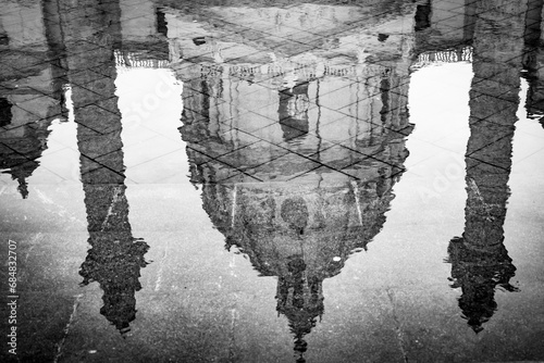 Vienna, Austria. Columns and dome of the St. Charles Church (Karlskirche) reflected in the pond of the Resselpark. Black and white image.