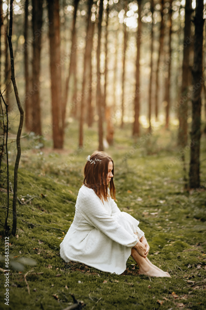 a young girl in a white dress in a green pine tree
the forest a young girl in a white dress in a green pine tree
the forest