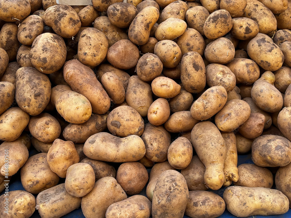 Organic fresh potatoes at the market stall. Organic fresh potatoes at the market stall.