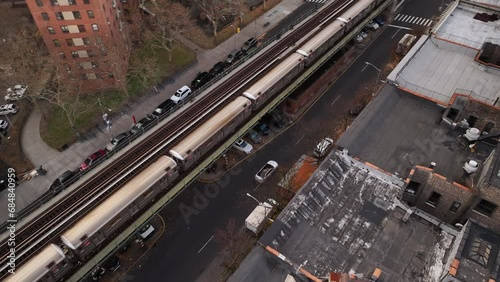 Aerial shot of New York City's 1 train passing through Harlem on an autumn morning. photo