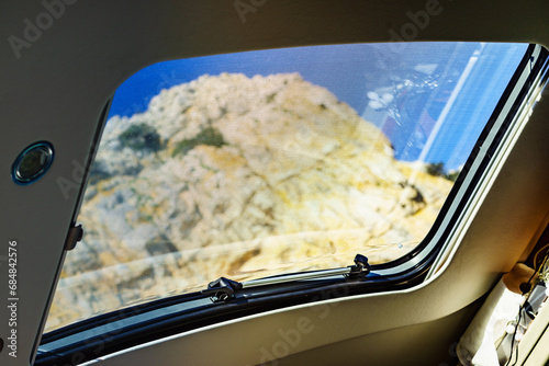 Sunroof, raisable window on roof top of camper photo