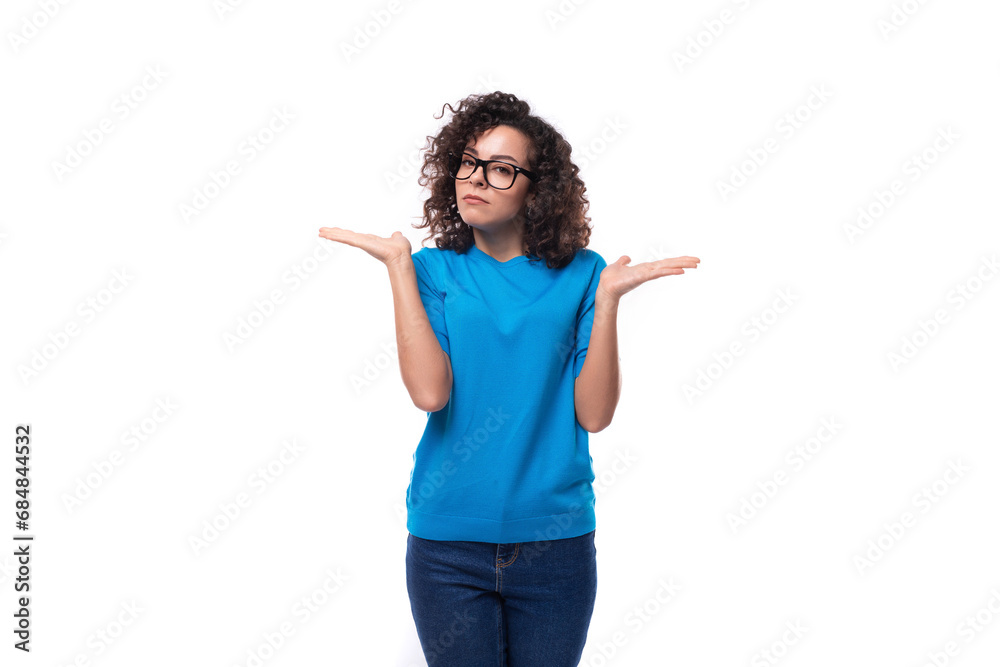 young cheerful curly woman with black hair dressed in a blue corporate t-shirt with print mockup young cheerful curly woman with black hair dressed in a blue corporate t-shirt with print mockup
