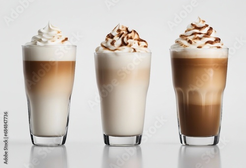 Three different latte macchiato on isolated white background photo