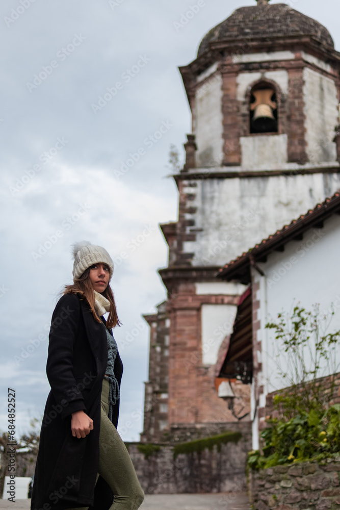 Fototapeta premium Young woman tours rural Zugarramurdi.