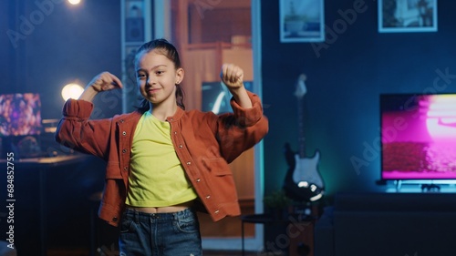 Stampa su tela Close up shot of energetic joyful kid doing charming dance moves for social media platform, following viral challenge