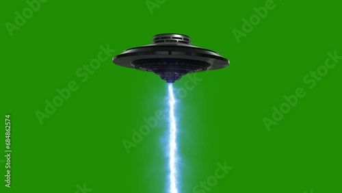 Flying UFO with a laser on a green background