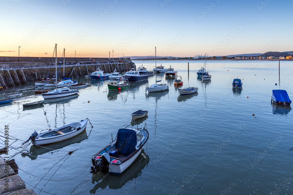 Fototapeta premium The old harbour at Minehead on the Somerset coast at sunrise.