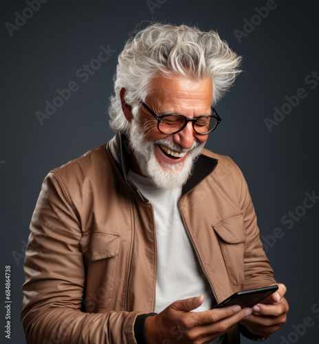 Senior man, casual business wear and phone for social media app, internet and website on grey background mockup. Face, smile and happy pensioner with mobile technology for influencer blog post in stu