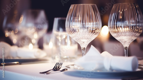 table setting with glasses on a festive evening, restaurant, christmas luxury table photo