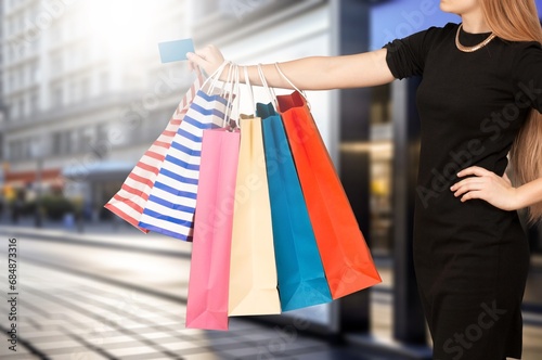 Hand of woman holding shopping bag
