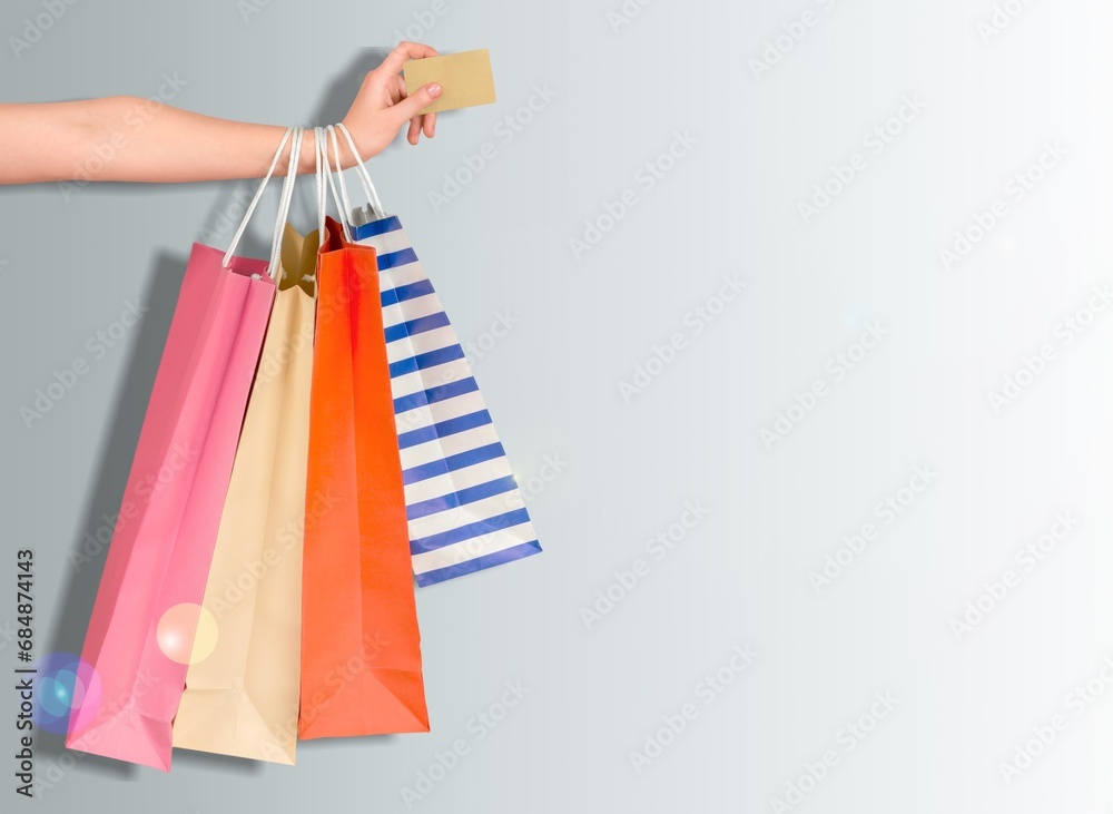 Hand of woman holding shopping bag