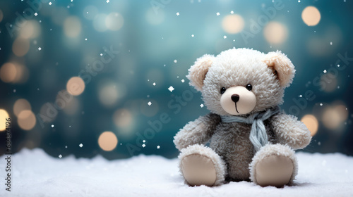 Winter banner with teddy bear wearing a cute scarf and hat. Snowing, Christmas. © Jacques Evangelista