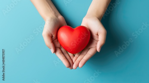 Heart held by woman s hands on colorful background. World health day