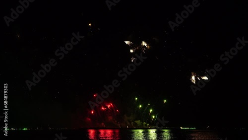 Real fireworks background. Firework Display, abstract blur of real golden shining fireworks lights at night sky. glowing fireworks show. Firework Explosive Material. New year's eve fireworks	

