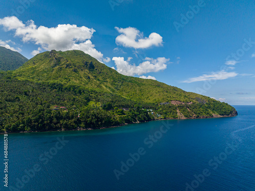 Mountain cliff near the coast. Blue sea in Camiguin Island. Philippines. © MARYGRACE