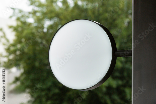 Circular Signage on Natural Green Tree Background