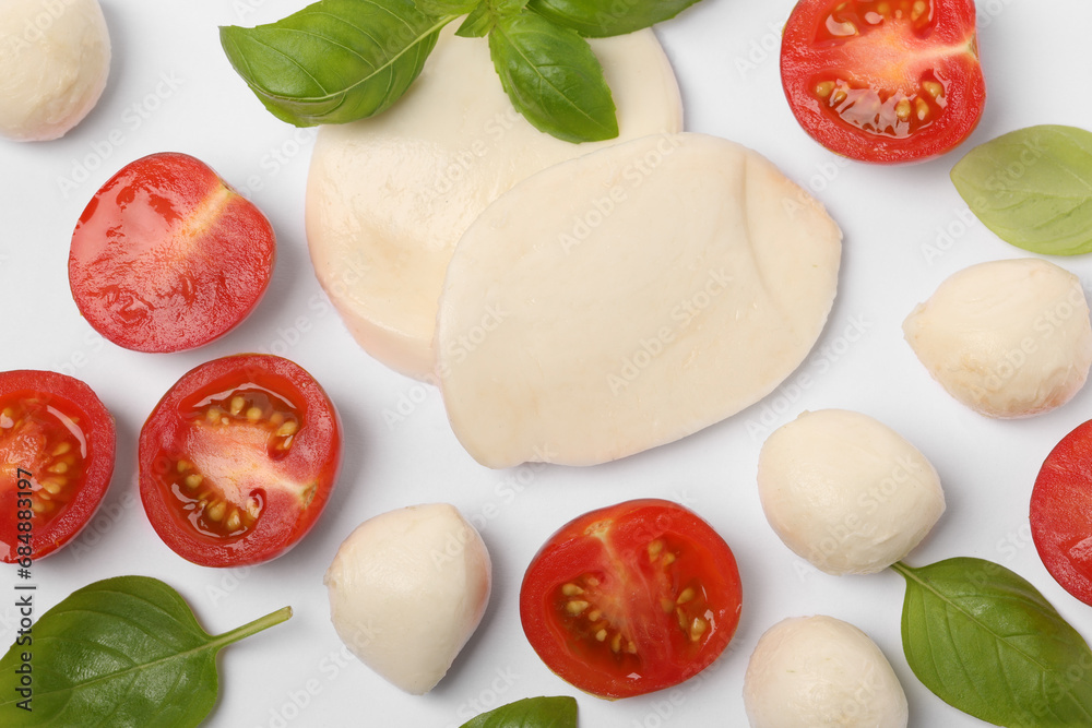 Mozzarella, tomatoes and basil on white background, flat lay. Caprese salad ingredients