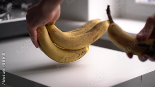 bunch of ripe yellow bananas with black dots