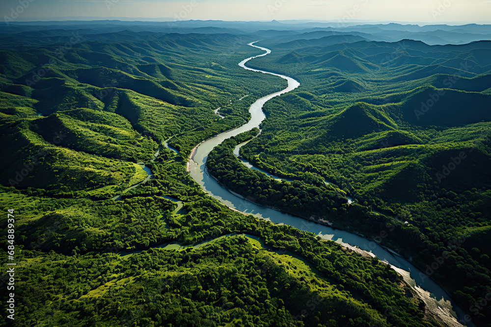 A river running through a lush green valley A river running through a lush green valley