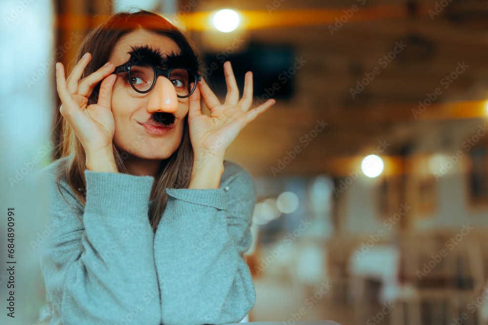 Funny Woman Wearing Silly Mustache Party Accessories Glasses . Girl with a sense of humor using disguise eyeglasses for a prank
 - obrazy, fototapety, plakaty 