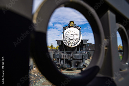 Unusual perspective through wrought iron fencing of Union Pacific Locomotive No.2252, one of the oldest standard gauge SP locomotives in existence.  photo