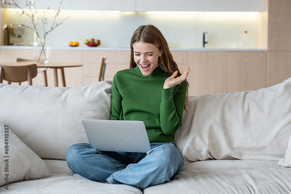 Happy woman winner trader, crypto investor, entrepreneur, financier freelancer looking at laptop screen rejoicing sitting on couch at home. Having goal, achievement at work. Digital nomad, freelance. Happy woman winner trader, crypto investor, entrepreneur, financier freelancer looking at laptop screen rejoicing sitting on couch at home. Having goal, achievement at work. Digital nomad, freelance.