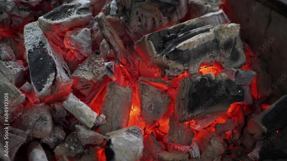 Close-up of hot firewood glowing and burning. Close-up of hot firewood glowing and burning.