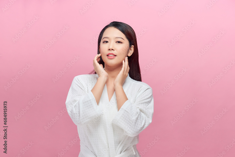 Banner of Young slim woman who gently touches and strokes her jawline and look at the camera. Banner of Young slim woman who gently touches and strokes her jawline and look at the camera.