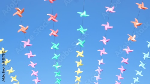 Decoration of the venue with small windmills of various colors during the New Year festival.
