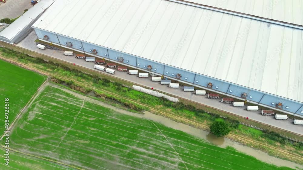 From high above, a distribution center sprawls out like a futuristic maze, as drones crisscross the sky, orchestrating the flow of products below.
From high above, a distribution center sprawls out like a futuristic maze, as drones crisscross the sky, orchestrating the flow of products below.