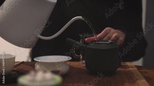 person pour a cup of tea