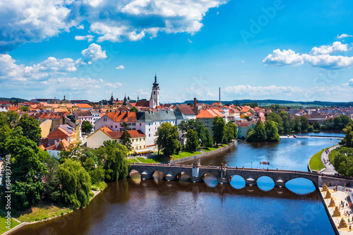 Medieval Town Pisek and historic stone bridge over river Otava in the Southern Bohemia, Czech Republic. Pisek Stone Bridge, the oldest preserved early Gothic bridge in the Czech republic. photo