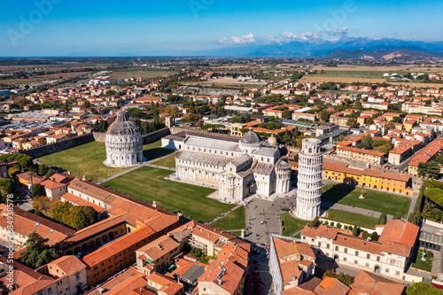 Pisa Cathedral and the Leaning Tower in a sunny day in Pisa, Italy. Pisa Cathedral with Leaning Tower of Pisa on Piazza dei Miracoli in Pisa, Tuscany, Italy. © daliu