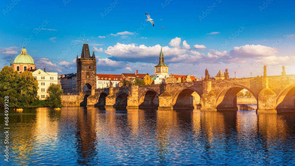 Old town of Prague. Czech Republic over river Vltava with Charles Bridge on skyline. Prague panorama landscape view with red roofs.  Prague view from Petrin Hill, Prague, Czechia.