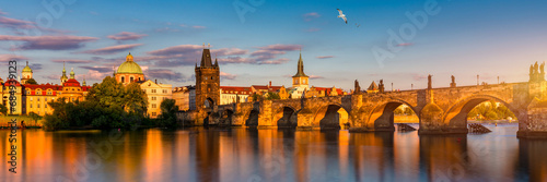 Charles Bridge in Prague in Czechia. Prague, Czech Republic. Charles Bridge (Karluv Most) and Old Town Tower. Vltava River and Charles Bridge. Concept of world travel, sightseeing and tourism. © daliu