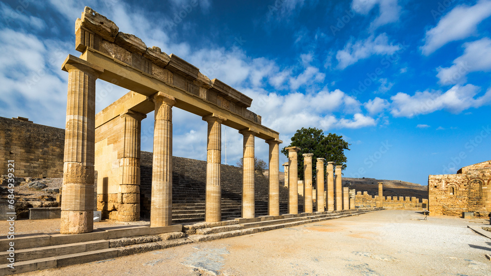Fototapeta premium Ruins of Acropolis of Lindos view, Rhodes, Dodecanese Islands, Greek Islands, Greece. Acropolis of Lindos, ancient architecture of Rhodes, Greece.