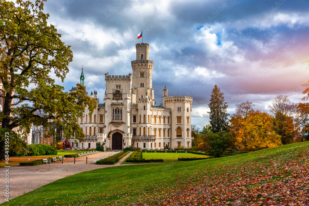 Obraz premium Castle Hluboka nad Vltavou is one of the most beautiful castles in Czech Republic. Castle Hluboka nad Vltavou in autumn with red foliage, Czechia. Colorful autumn view of Hluboka nad Vltavou castle.
