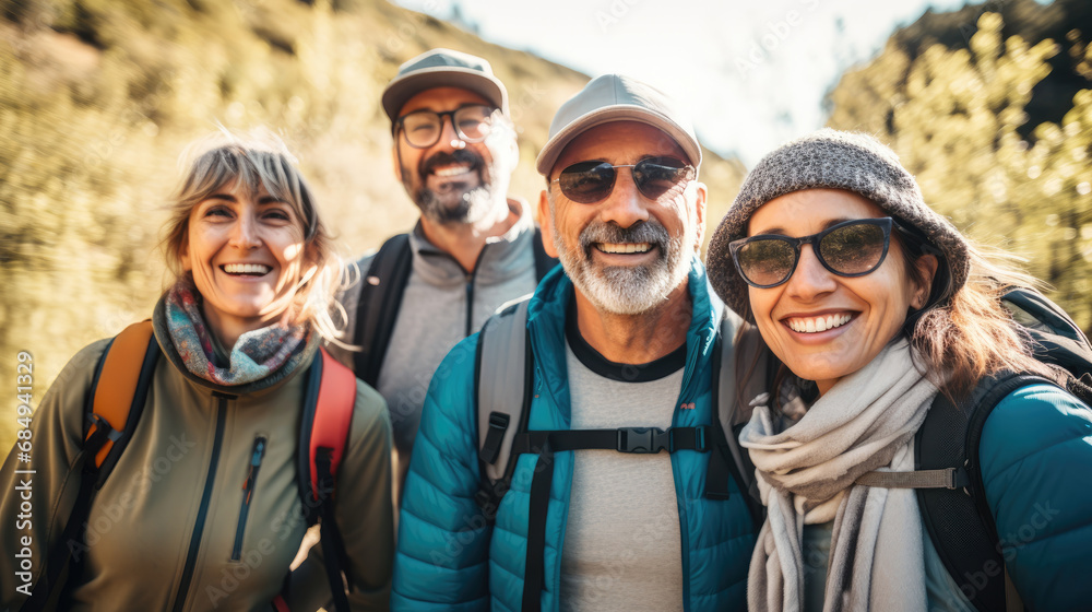 Group of middle-aged people looking at camera smiling spend free time trekking in national park with flower glasses field, retired pensioner lifestyle outdoor activities, autumn season, widow sunset Group of middle-aged people looking at camera smiling spend free time trekking in national park with flower glasses field, retired pensioner lifestyle outdoor activities, autumn season, widow sunset