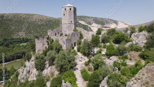 Medieval tower of ancient castel built in mountain, citadel balkan city Pocitelj photo