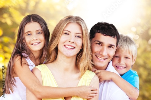 Happy young parents with children outdoor