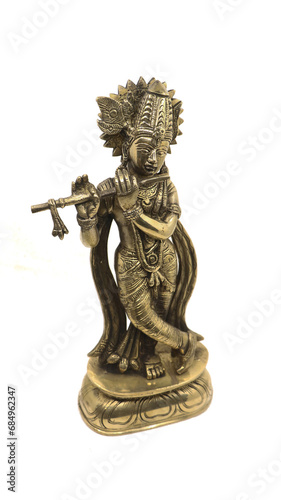 lord krishna playing flute music, an avatar of vishnu god of hindu religion, shiny bronze statue with a crown and ornamental details isolated in a white background